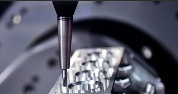Image shows a 5 axis CNC machine that Keller Technology uses to ensure consistent quality for advancement manufacturing.